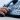 close up employee man hand point to press button number on telephone office desk for contact