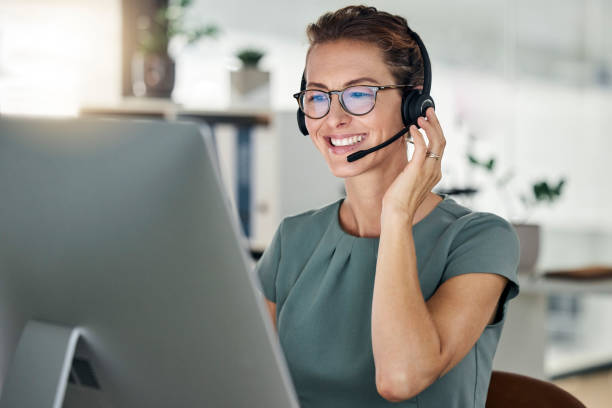 happy call center and computer woman and headphones at desk customer support or sales for
